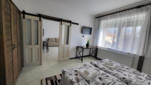 Posteľ alebo postele v izbe v ubytovaní Relax Apartments Sárvár A1