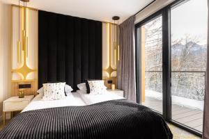 Posteľ alebo postele v izbe v ubytovaní Tatry Residence SPA