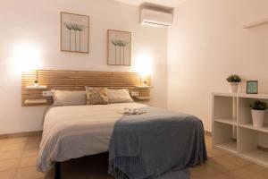 Posteľ alebo postele v izbe v ubytovaní Reding 5 FreshApartments
