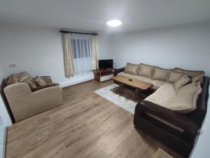 a living room with a couch and a table at Apartman Jakša in Žabljak