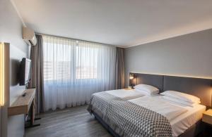 Postel nebo postele na pokoji v ubytování Holiday Inn Düsseldorf-Neuss by IHG