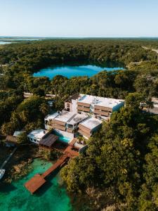 an aerial view of a resort in the water at Hotel Amainah Bacalar Adults Only in Bacalar