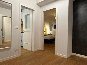 A bed or beds in a room at Ulivo Suites - apartments