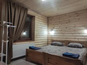 Postel nebo postele na pokoji v ubytování У Мирослави