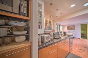 a kitchen with a sink and a counter at Tulsa Rental Home - Walk to Philbrook Museum in Tulsa