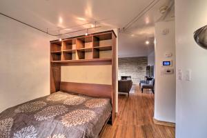 a bedroom with a bunk bed and a living room at Tulsa Rental Home - Walk to Philbrook Museum in Tulsa