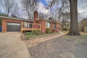 a brick house with a porch and a tree at Tulsa Rental Home - Walk to Philbrook Museum in Tulsa