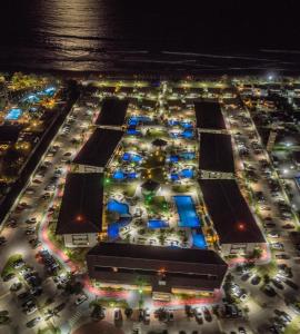 an aerial view of a parking lot at night at Cupe Beach Living Flat in Ipojuca