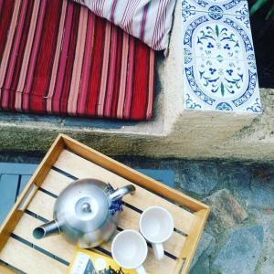 a tray with a tea kettle and two cups at Villa CapCerbere in Cerbère