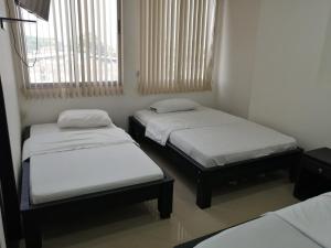 Ένα ή περισσότερα κρεβάτια σε δωμάτιο στο San pedro suite +7 φωτογραφίες