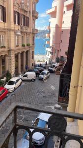 a view from a balcony of a street with cars at Chiatamone Luxury Home in Naples