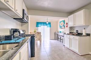a kitchen with white cabinets and a counter top at Pet-Friendly Home Less Than 6 Mi to National Mall! in Hillcrest Heights