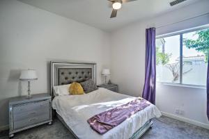 a bedroom with a bed and a window with purple curtains at Private Pool and Spa Spacious Home in Bermuda Dunes in Bermuda Dunes +22 photos