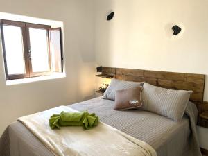A bed or beds in a room at Ikigai