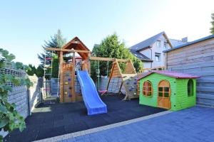 a playground with a slide and a play set at Comfortable apartment with a balcony, very close to the sea, Ustronie Morskie in Ustronie Morskie