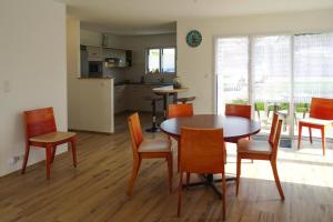 a kitchen and dining room with a table and chairs at Holiday Home Morgat near Sandy Beach in Morgat