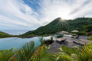 a resort with a view of a mountain at MATHIS Lodge Amed in Amed