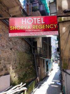 a sign for a hotel showa agency on a building at Shorya Regency Near Mall Road Shimla in Shimla