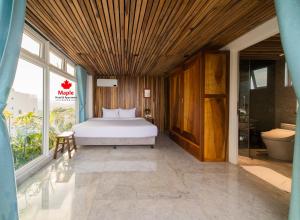 Postel nebo postele na pokoji v ubytování Maple Hotel & Apartment + 37 fotografií