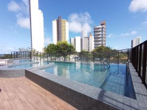 a swimming pool on the roof of a building at ILUSION FLAT-Ponta Negra in Natal