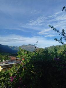 a view of a valley with mountains in the background at Hotel Rabin Itzam in Lanquín