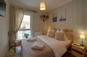 Posteľ alebo postele v izbe v ubytovaní Trevilles apartamenty - Pod Lasem