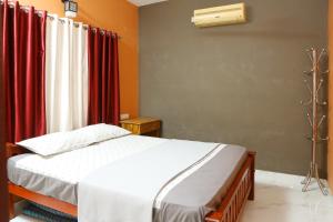 Ένα ή περισσότερα κρεβάτια σε δωμάτιο στο PAUL'S HOME STAY