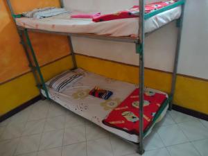 Uma cama ou camas num quarto em Casa Minha Backpackers Hostel