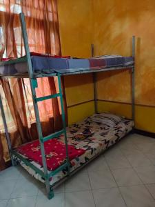 Uma cama ou camas num quarto em Casa Minha Backpackers Hostel