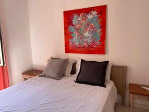 A bed or beds in a room at Casa Viola di Maria Gabriella, San Vito a 25 minuti da Costa Rey e Villasimius