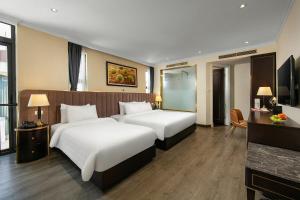 Postel nebo postele na pokoji v ubytování San Palace Hotel & Spa