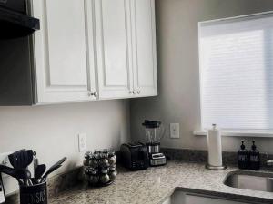 a kitchen with a counter top with a blender at Quiet & Quaint apartment, 5 mins to airport and 15 mins to downtown in Atlanta