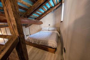 Tempat tidur dalam kamar di Agriturismo Rivet d'Or