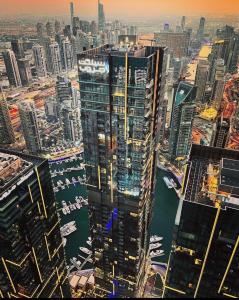 a view of a city with a large building at Torch 77 in Dubai