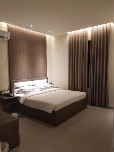 Postel nebo postele na pokoji v ubytování Sanghyang Indah Spa Resort