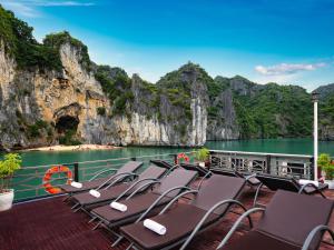 a group of chairs sitting on the deck of a boat at La Pandora Boutique Cruises in Ha Long +39 photos