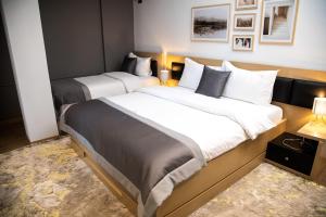 Postel nebo postele na pokoji v ubytování Triss Hotel
