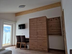 Televízia a/alebo spoločenská miestnosť v ubytovaní Appartement Sami