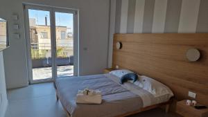 Postel nebo postele na pokoji v ubytování B&B PeRnotti