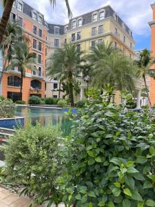 a hotel with a pool in front of a building at SK BOUTIQUE HOTEL in Phú Quốc