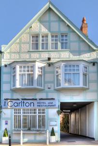 a large blue building with a sign in front of it at The Carlton in Rugby