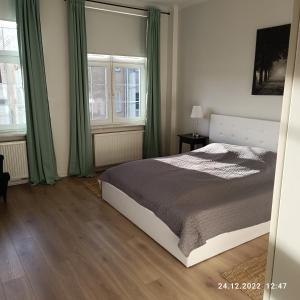 Posteľ alebo postele v izbe v ubytovaní Apartament Długa 35