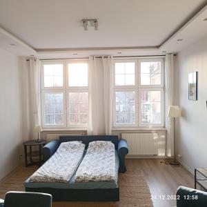 Posteľ alebo postele v izbe v ubytovaní Apartament Długa 35