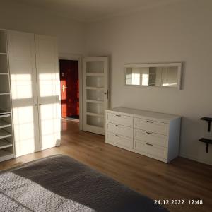 Posteľ alebo postele v izbe v ubytovaní Apartament Długa 35