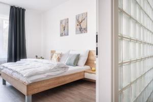 Postel nebo postele na pokoji v ubytování Self check-in apartments by Amber