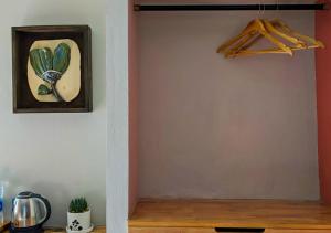 a room with a door with a painting on the wall at The Oak Retreat Lamahatta in Darjeeling +13 photos