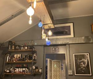 a bar with lights and a shelf in a room at The Foulsyke Licensed Bed and Breakfast Scalby Scarborough in Scarborough