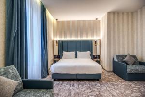 Postel nebo postele na pokoji v ubytování CC Palace Hotel + 37 fotografií