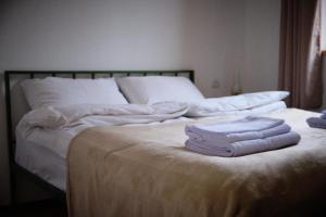 Ένα ή περισσότερα κρεβάτια σε δωμάτιο στο Kotun Gyumri