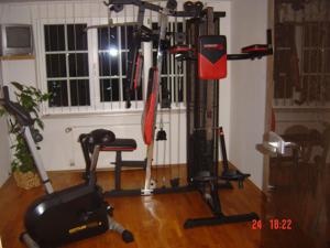 a room with a gym with several exercise equipment at Gaststätte & Pension Alte Mühle in Dorfchemnitz